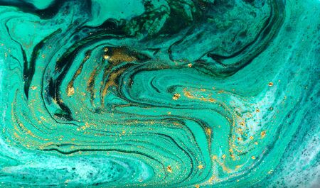Green and gold marbling pattern. Golden powder marble liquid textureの写真素材
