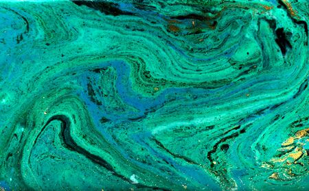 Blue, green and gold marbling pattern. Golden powder marble liquid texture.の写真素材