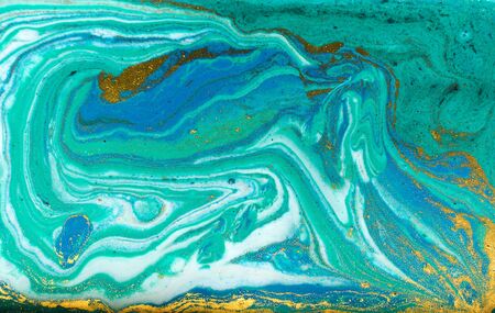 Blue, green and gold marbling pattern. Golden powder marble liquid texture.の写真素材