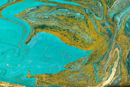 Amazing luxury yellow gold marble background with blue and black layers.の写真素材