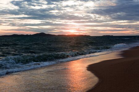Sunset sea beach. Clouds on the skyの写真素材