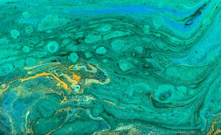 Green and gold ripple of agate background. Golden powder marble texture.の写真素材