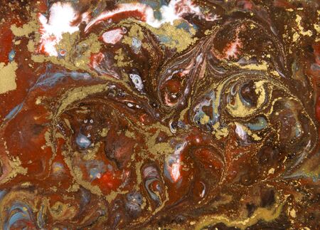 Brown and gold marbling pattern. Golden marble liquid texture.の写真素材