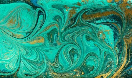 Green and gold ripple of agate background. Golden powder marble texture.の写真素材