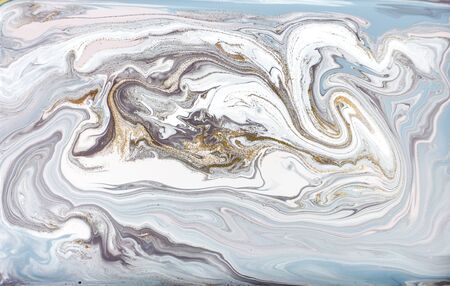 Blue and purple marble pattern with golden glitter. Abstract liquid background.の写真素材