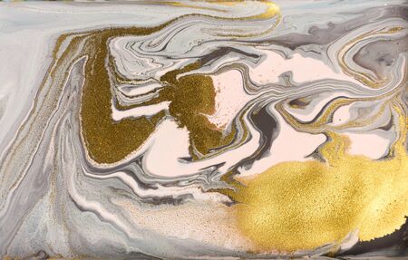 Marble pattern with golden glitter. Abstract liquid background.