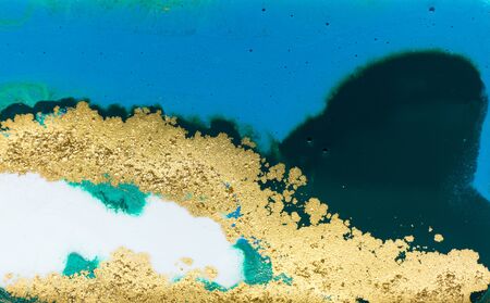 Blue and gold ink background
