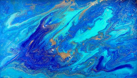 Marbled blue and gold abstract background. Liquid marble pattern.