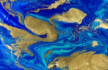 Marbled blue and gold abstract background. Liquid marble patternの写真素材