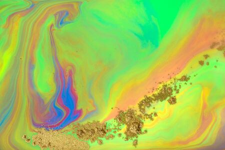 Green abstract pattern with golden powder scattering.の写真素材