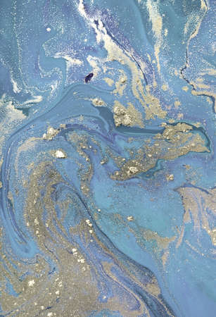 Abstract gold and blue liquid pattern.