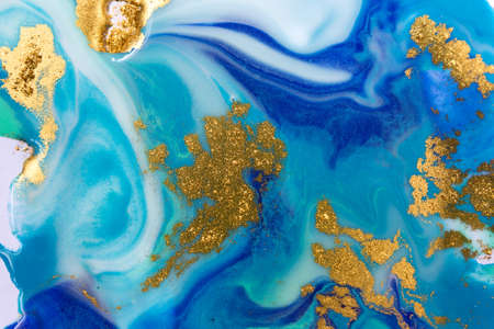 Marbled blue and gold abstract background. Liquid marble pattern.