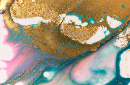 Golden glitter scattering background. Sparkling gold and blue texture.