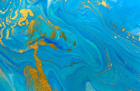 Marbled blue and gold abstract background. Liquid marble pattern.