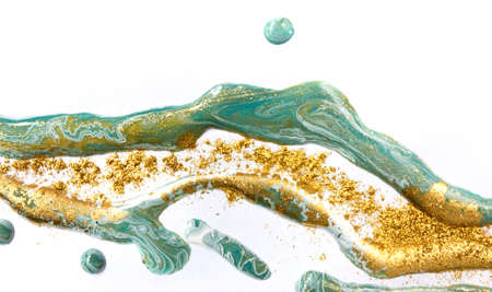 Gold and green mixed inks splattered on white paper background