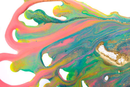 Pink, gold and blue mixed inks splattered on white paper background.