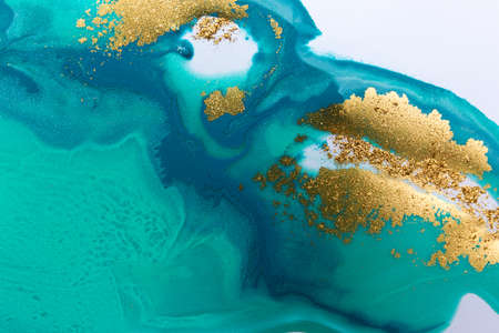 Aquamarine pattern with golden splashes on white background.の写真素材