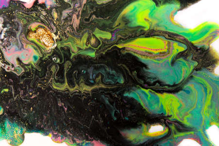 Black and fluorescent mixed inks spilled on white background