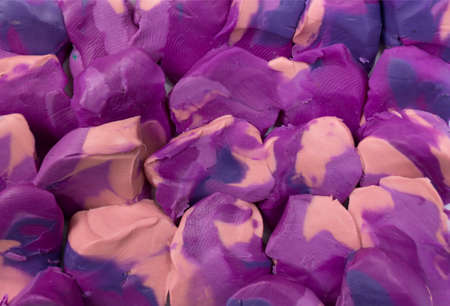 Violet plasticine scale background. Close up texture.