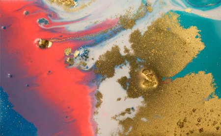 Marbled blue and pink abstract background with golden glitter.