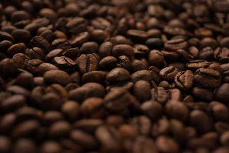 Roasted coffee beans close up blur background