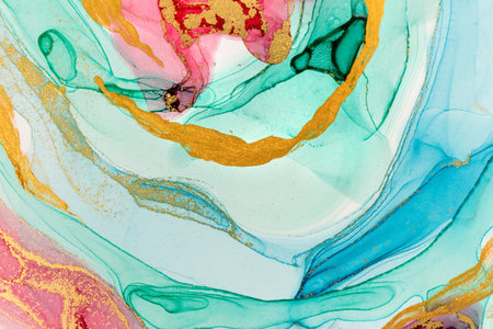 Abstract layers of pink paint on white background. Pink, green, blue and gold watercolor pattern.の写真素材