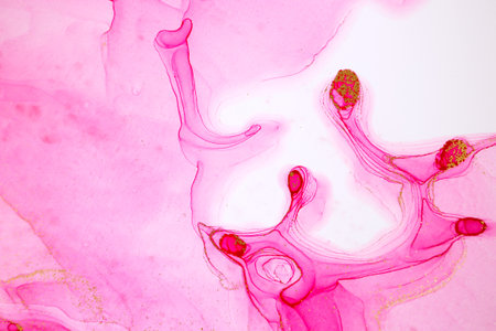 Alcohol ink pink and gold abstract stains background. Drops watercolor transparent texture.