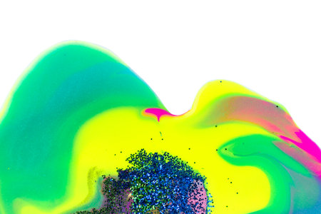 Blue, green and gold glitter and fluorescent liquid inks on white background