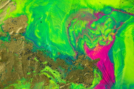 Frozen ink pattern with golden particles. Fluorescent bright background.