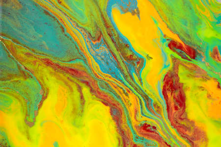 Abstract bright marble pattern with golden glitter. Fluorescent artwork liquid paint background.の写真素材