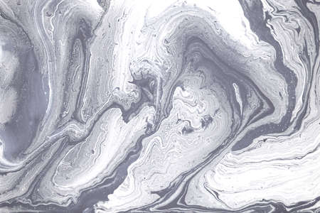 Grey and white marble texture. Liqued ink background.
