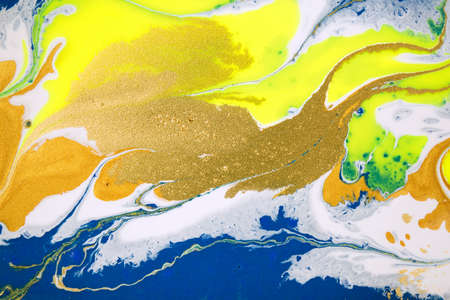 Gold glitter wave pattern. Fluorescent artwork liquid paint background.