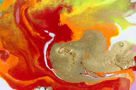 Abstract red marble pattern with gold glitter. Liquid paint background.の写真素材