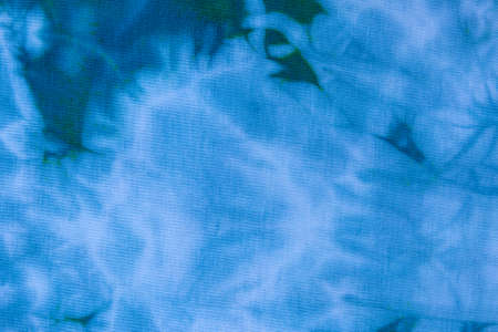 Close up tie dye fabric pattern. Hand made texture.