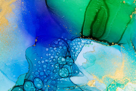 Aquamarine alcohol ink gradient texture. Abstract watercolour background with gold powder.の写真素材