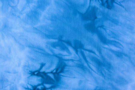 Close up tie dye fabric pattern. Hand made texture.の写真素材