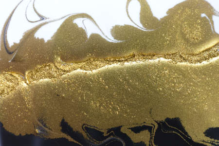 Abstract white and black texture with gold glitter.の写真素材