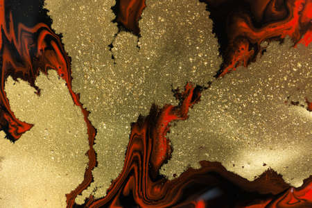 Gold spots on dark red and black flow background. Abstract texture.