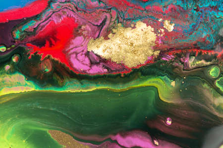 Gold spots on flow vivid paints background. Abstract print