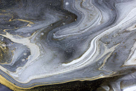 Marble gray abstract acrylic background with gold dust.