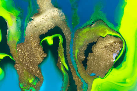 Gold spots on flow vivid paints background. Abstract print
