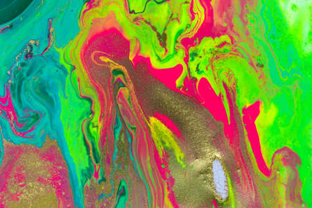 Gold spots on flow vivid paints background. Abstract printの写真素材