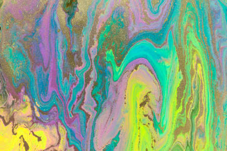 Gold texture on fluorescent paints mix flow background.