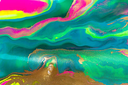 Abstract liquid ink gradient pattern with gold dust. Fluorescent liquid bright texture.