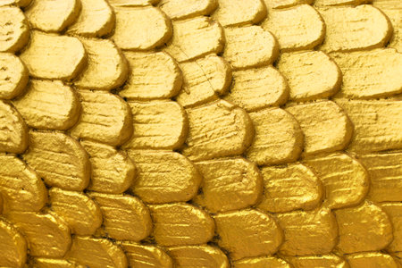 Abstract golden scales close up textureの写真素材