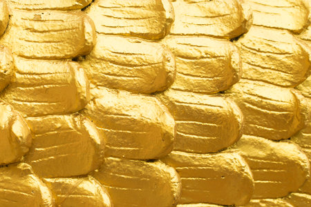 Abstract golden scales close up textureの写真素材