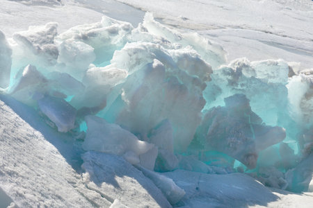 Blue Ice Clear Transparent Hummocks on the Frozen Lakeの写真素材