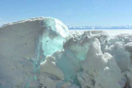 Blue Ice Clear Transparent Hummocks on the Frozen Lakeの写真素材