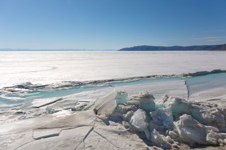 Frozen Lake and Snowy Mountains Winter Landscapeの写真素材