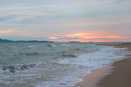 Raging Sea on the Pink Sunset Sky Backgroundの写真素材